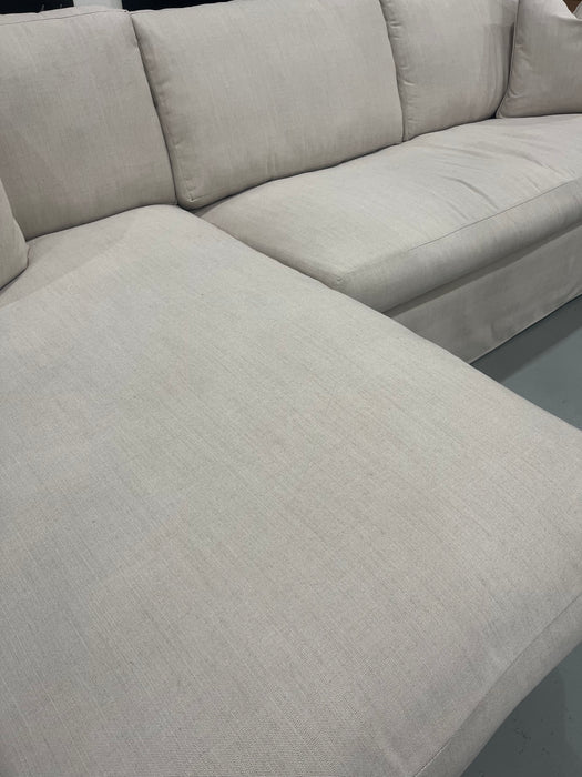 Beige Slipcovered Left Facing Sectional